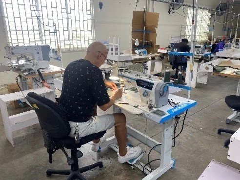 Sewing machine operator on the Bethel Yuut production floor